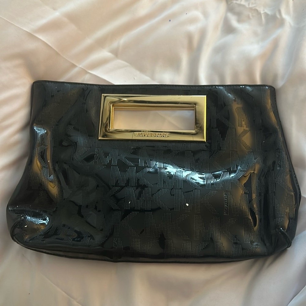 Micheal Kors clutch black paten leather gently used